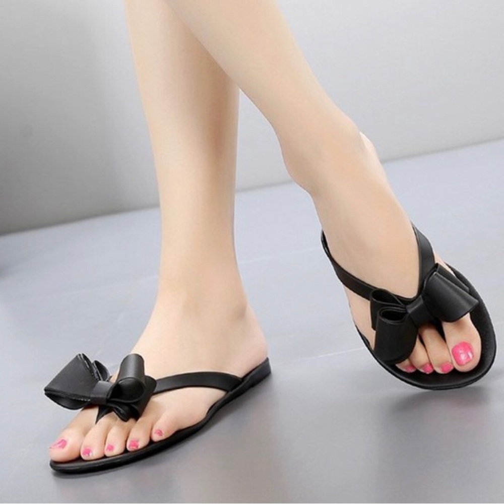 BLACK JELLY SLIP ONS